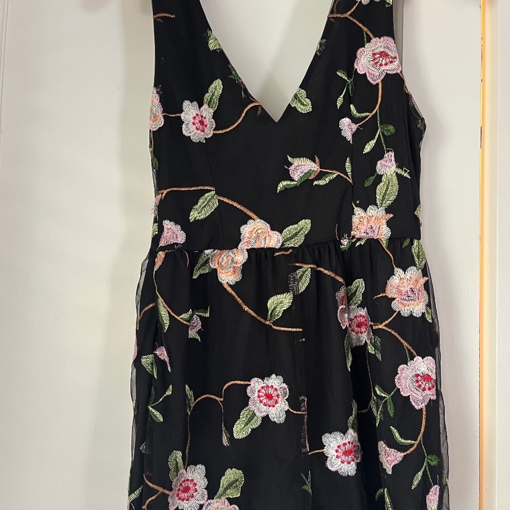 Urban Outfitters dressy Black with colored flowers romper. Size M